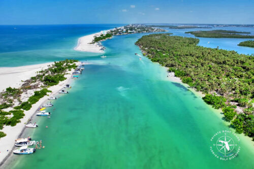 Aerial view of Ski Alley at Milton Pass on Manasota Key in August 2025, showing boats along the shoreline and the new pass created by Hurricane Milton.