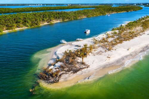 Aerial view of the south side of newly formed Milton Pass at Stump Pass Beach State Park on Manasota Key, Southwest Florida.