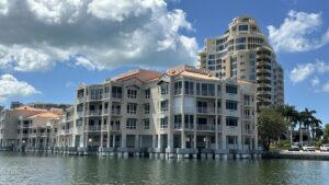 Waterfront residential scene featuring modern condominiums, Naples with Florida Gulf Discoveryv