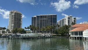 on center The Allegro 14-story, on left The Brittany 21-story, condominium, in the Park Shore, Naples with Florida Gulf Discovery