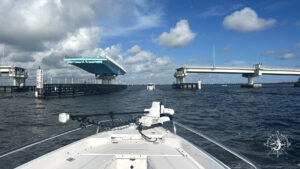 Boat approaching the Boca Grande swing bridge and drawbridge entrance near Gasparilla Pass during a private tour in Southwest Florida