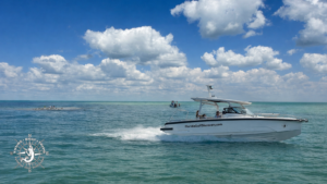 Florida Gulf Discovery boat cruising through shallow turquoise waters near Bokeelia Sandbar in Pine Island Sound Florida