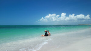 Guests relaxing in turquoise Gulf waters at North Beach on Cayo Costa during a private boat trip in Southwest Florida