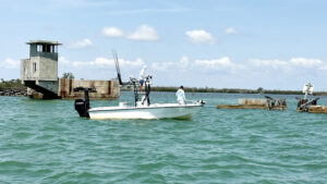 Fishing boat near the historic Placida trestle remnants along the Intracoastal Waterway near Gasparilla Pass in Southwest Florida