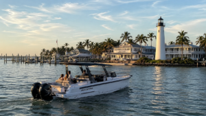 Private boat tour near Port Boca Grande Florida aboard Axopar 29 cruising past the historic Gasparilla Island lighthouse and waterfront marina