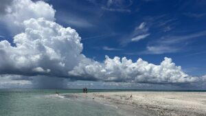 Massive storm clouds forming over the sandbar at Stump Pass in Southwest Florida during a private boat excursion