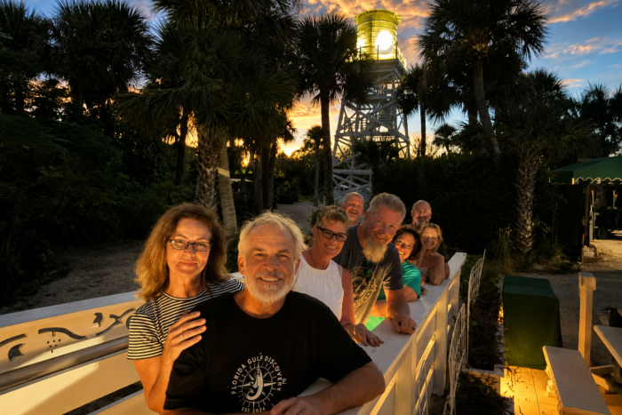 Cabbage Key Water Tower at Sunset | Before Dinner Guests gather beneath the historic Cabbage Key Water Tower before dinner at sunset during a private boat tour with Captain Pavel.