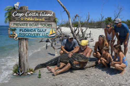 Captain Pavel holding an alligator on Cayo Costa Island while a family watches during a private boat tour in Southwest Florida.