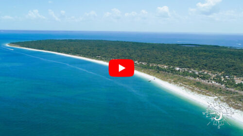 Drone view of the north Gulf coastline of Cayo Costa State Park in Southwest Florida showing pristine white-sand beaches, turquoise Gulf waters, and untouched coastal forest.
