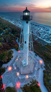 Gasparilla Island Rear Range Light lighthouse illuminated at sunset overlooking the Gulf of Mexico on Gasparilla Island, Florida.