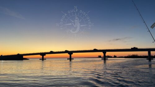 Sunset at Gasparilla Pass Bridge during a private boat cruise in Southwest Florida.