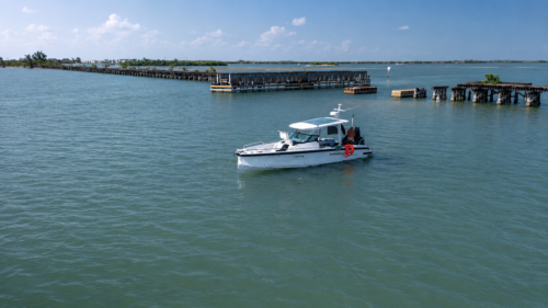 Captain Pavel's Axopar 29 anchored beside the Historic Placida Trestle in Placida, Florida, where an unforgettable dolphin encounter began.