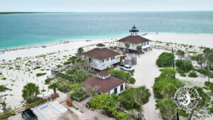 Aerial drone view of the historic Port Boca Grande Lighthouse and museum at the southern tip of Gasparilla Island, Florida