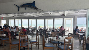 Dining room and beachfront views inside South Beach Bar & Grille on Gasparilla Island in Boca Grande, Florida.