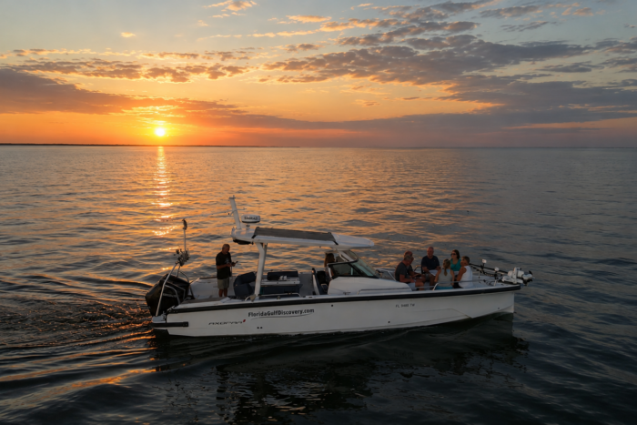 Sunset Cruise Southwest Florida | Florida Gulf Discovery Sunset cruise aboard an Axopar 29 in Southwest Florida with guests enjoying calm Gulf waters at sunset.