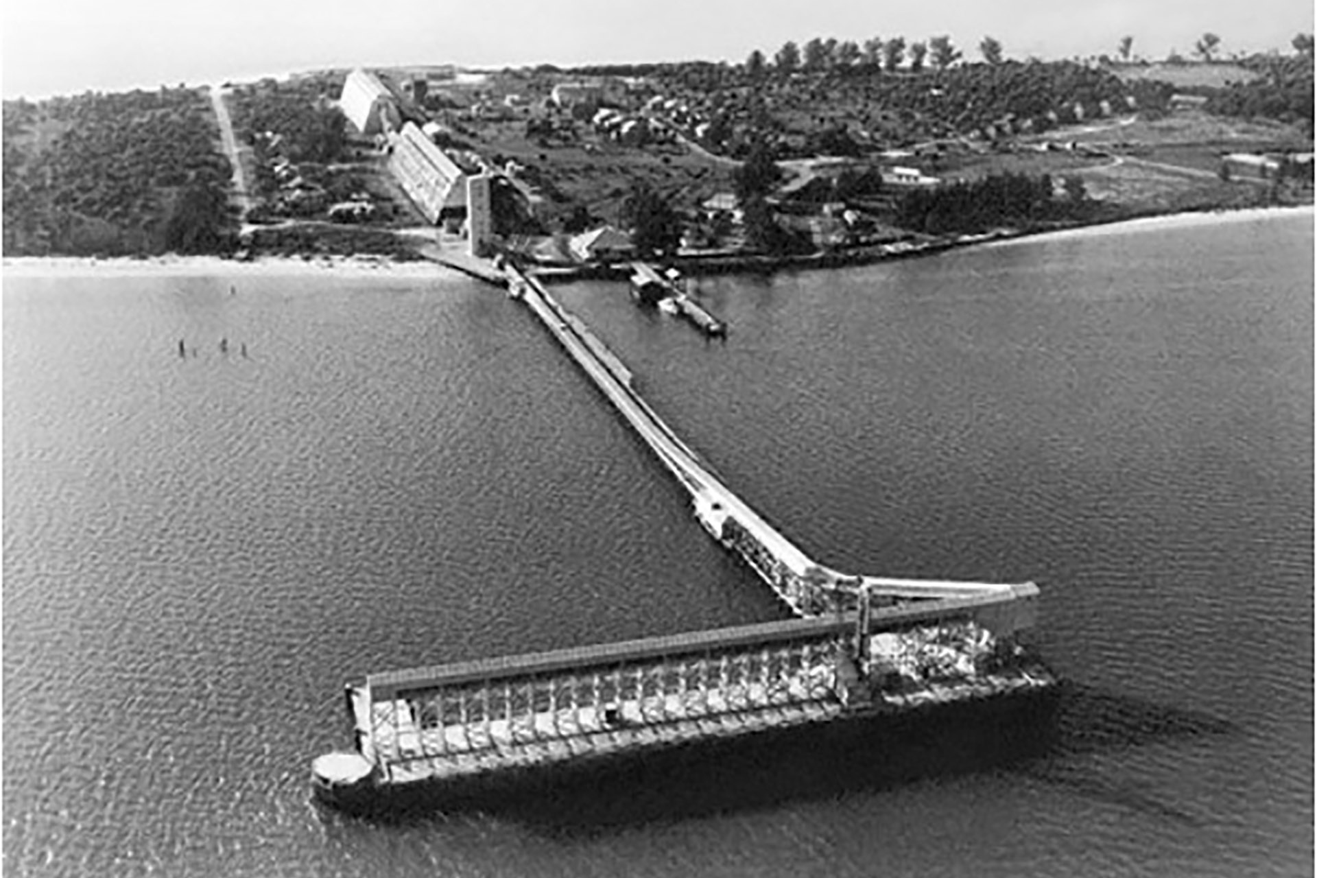 Historic aerial photograph of the Boca Grande phosphate terminal and loading docks on Gasparilla Island around 1940.