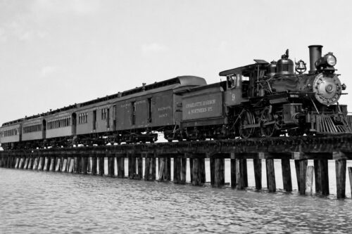Historic steam train of the Charlotte Harbor & Northern Railway crossing the Placida Trestle to Boca Grande, Florida.