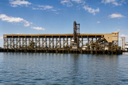 Historic phosphate loading docks at Port Boca Grande on Gasparilla Island, Florida, viewed from Charlotte Harbor during the twentieth century.