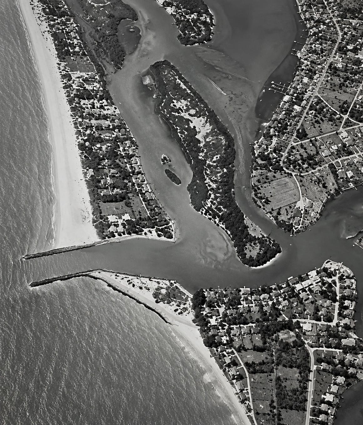 Historic 1957 aerial photograph of Venice Inlet and the north and south jetties in Venice, Florida