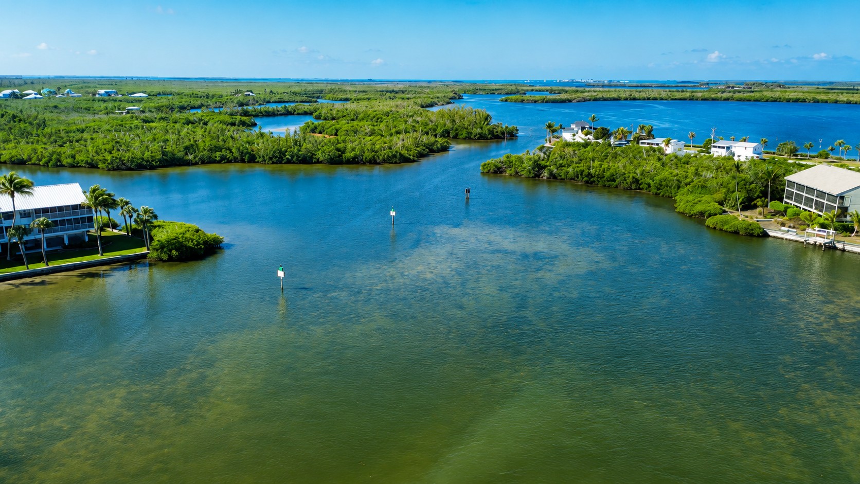 Aerial view of Little Bokeelia Bay, Back Bay, and Jug Creek showing mangrove shorelines, shallow coastal waters, and the protected estuaries of Pine Island, Florida.