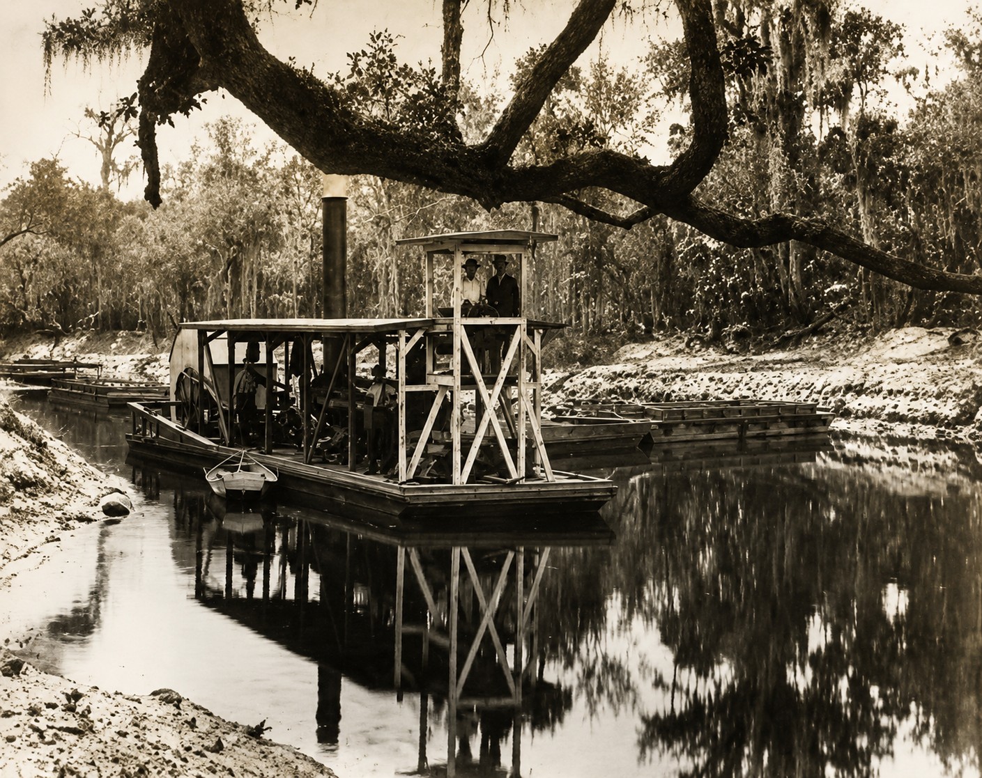 Historic photograph of a steam-powered tugboat pulling phosphate barges along the Peace River in Southwest Florida during the early phosphate industry.