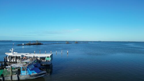 Aerial view of Safe Harbor Pineland Marina overlooking Pine Island Sound and Wilson Cut near Bokeelia, Florida.