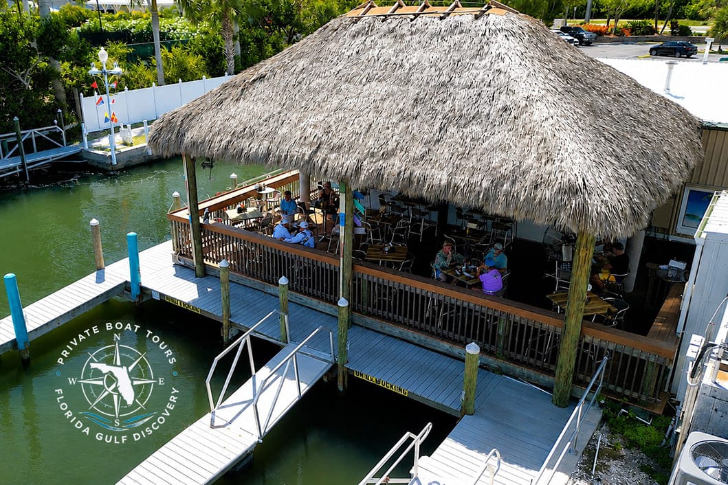 Aerial view of Smokin Jerry's Tiki Hut and Gasparilla Marina in Placida, Florida