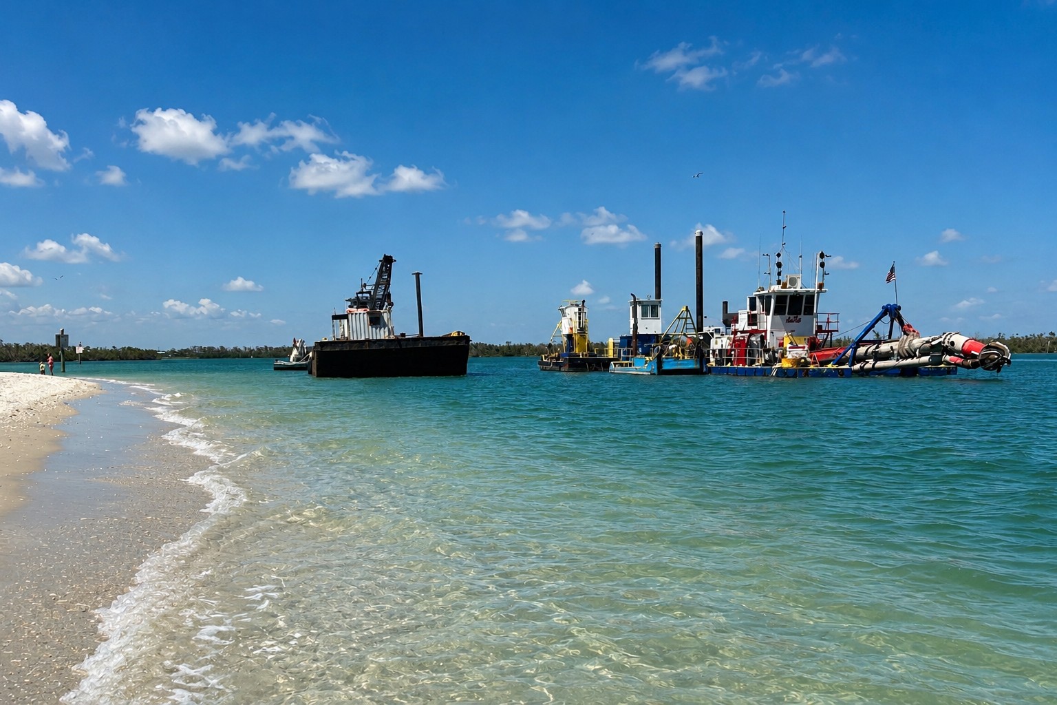 Dredging operations restoring the navigation channel at Stump Pass in 2025