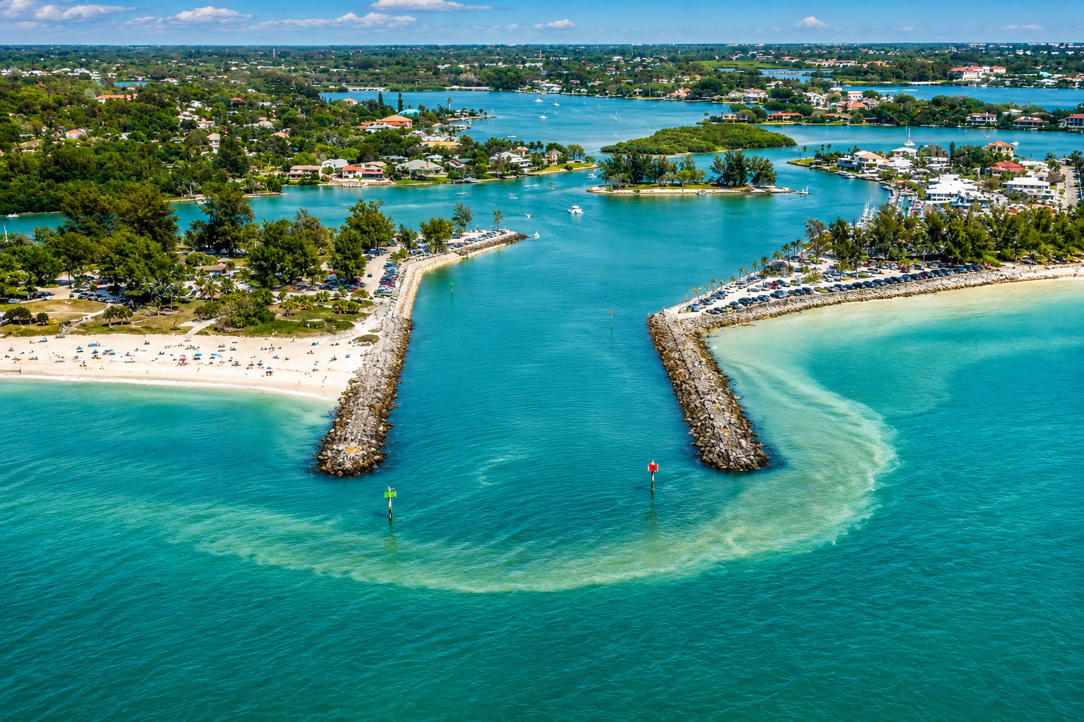 Drone view of Venice Inlet and its twin jetties connecting the Intracoastal Waterway to the Gulf of America in Florida