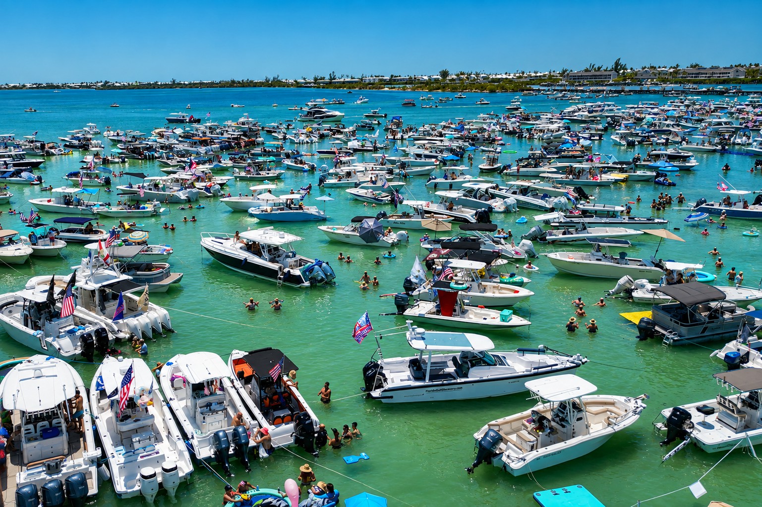Boats gathered around the floating stage at the 2025 Boca H2O Music Festival at Boca Grande Sandbar, Southwest Florida