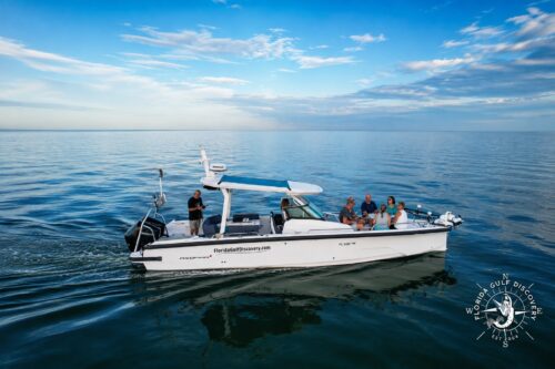 Florida Gulf Discovery private boat carrying guests across calm Southwest Florida waters on the way to Cabbage Key.