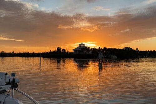 Sunset over Cabbage Key as seen from a boat approaching the island in Pine Island Sound, Southwest Florida.